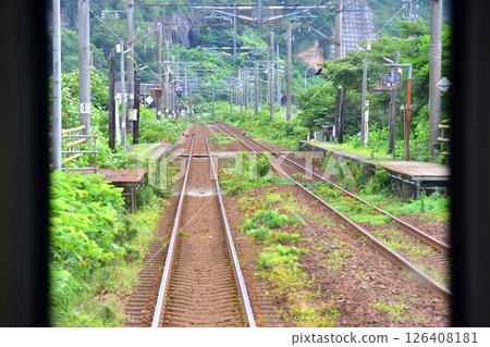 JR Hokkaido, Muroran Main Line, local train window view from Higashimuroran Station to Noboribetsu Station (cloudy sky in summer 2023) 126408181