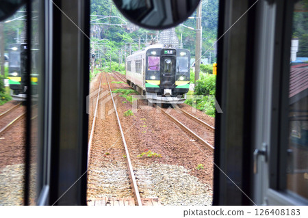 JR Hokkaido, Muroran Main Line, local train window view from Higashimuroran Station to Noboribetsu Station (cloudy sky in summer 2023) 126408183