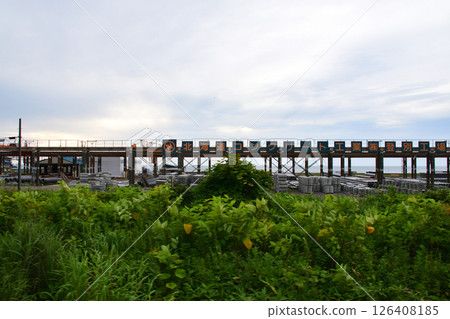 JR Hokkaido, Muroran Main Line, local train window view from Higashimuroran Station to Noboribetsu Station (cloudy sky in summer 2023) 126408185
