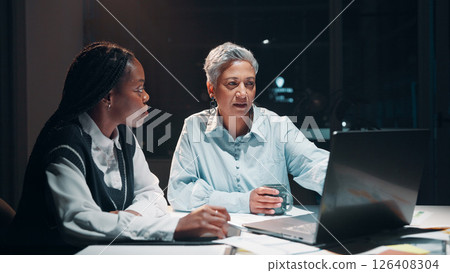 Business, women and meeting with laptop at night for planning, financial report and accounting deadline. People, team and online for finance budget, schedule update and information for working late 126408304