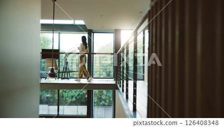 Break, business and coffee with woman in home office for professional career as journalist or publisher. Balcony, glass window and walking with freelance employee in apartment for remote work Break, business and coffee with woman in home office for professional career as journalist or publisher. Balcony, glass window and walking with freelance employee in apartment for remote work 126408348