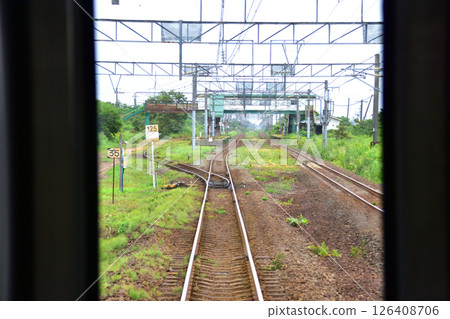 JR Hokkaido, Muroran Main Line, local train window view from Noboribetsu Station to Shiraoi Station (cloudy sky in summer 2023) JR Hokkaido, Muroran Main Line, local train window view from Noboribetsu Station to Shiraoi Station (cloudy sky in summer 2023) 126408706