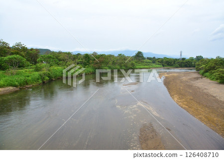 JR Hokkaido, Muroran Main Line, local train window view from Noboribetsu Station to Shiraoi Station (cloudy sky in summer 2023) 126408710