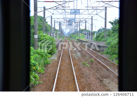 JR Hokkaido, Muroran Main Line, local train window view from Noboribetsu Station to Shiraoi Station (cloudy sky in summer 2023) 126408711