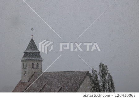 A church steeple covered in snow 126410062
