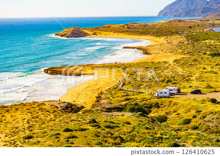 Coast view with camper rv camping on sea shore, Spain 126410625