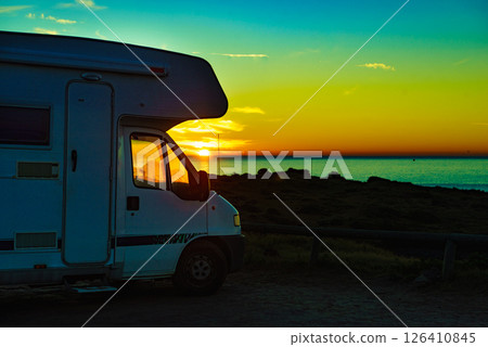 Camper vehicle on beach at sunrise Camper vehicle on beach at sunrise 126410845