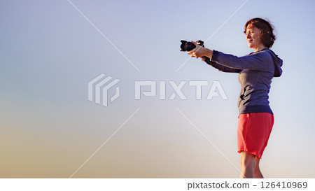 Woman with camera take travel photo Woman with camera take travel photo 126410969
