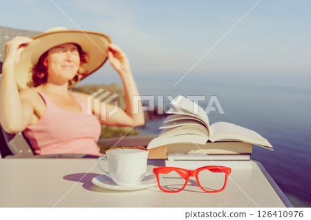 Woman on sea read book, relaxing 126410976