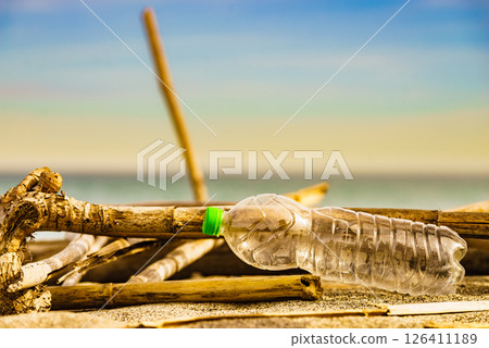 Plastic empty water bottle abandoned on nature Plastic empty water bottle abandoned on nature 126411189