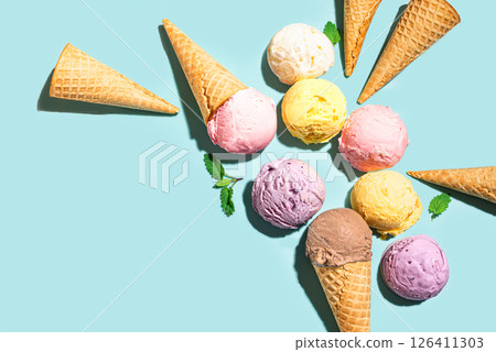 Ice cream scoops and waffle cones creative flat lay Ice cream scoops and waffle cones creative flat lay 126411303