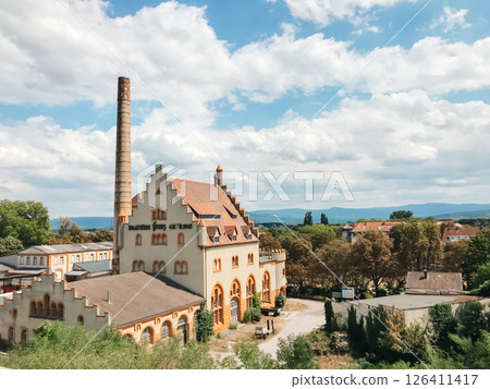 A large building with a tower and a sign that says Biergarten A large building with a tower and a sign that says Biergarten 126411417