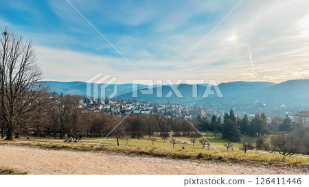 A beautiful mountain view with a small town in the distance 126411446