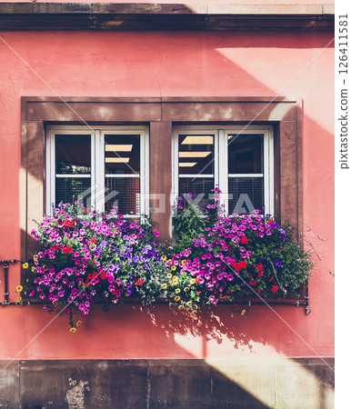 Window with a flower box on the sill 126411581