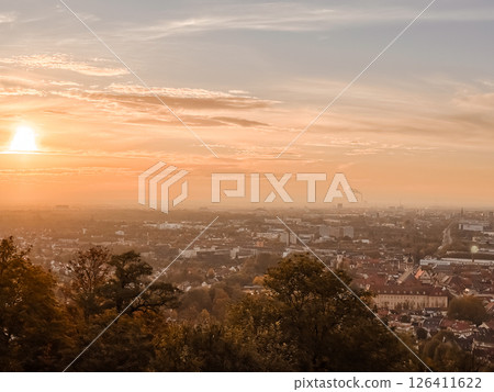City skyline with a beautiful orange sunset in the background City skyline with a beautiful orange sunset in the background 126411622
