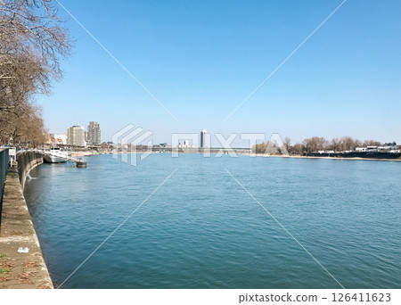 Calm river with a bridge in the background 126411623