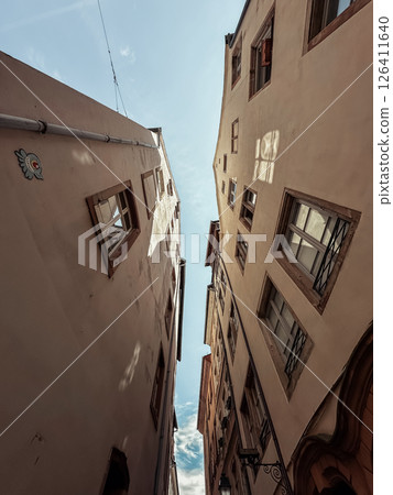 City street with two tall buildings on either side City street with two tall buildings on either side 126411640
