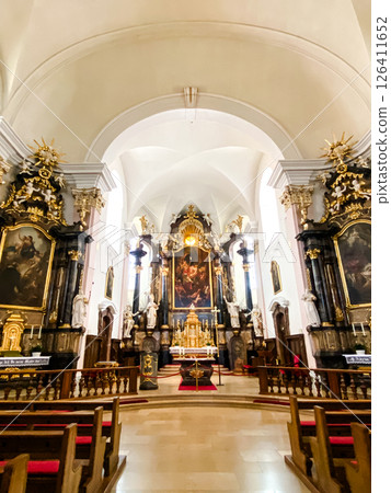 The interior of a church is very ornate and has a lot of gold accents The interior of a church is very ornate and has a lot of gold accents 126411652