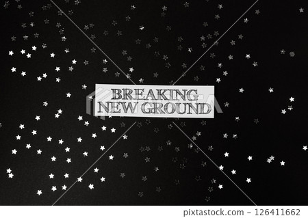 Black background with a white text that says Breaking New Ground 126411662