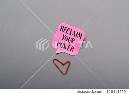 Pink sticky note with the words Reclaim Your Power written on it Pink sticky note with the words Reclaim Your Power written on it 126411733