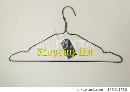 Shopping list is hanging on a clothes hanger 126411780