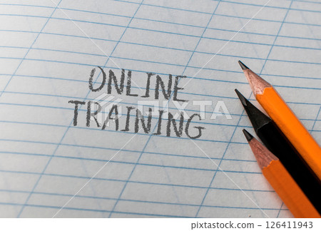 A piece of paper with the words Online Training written on it 126411943