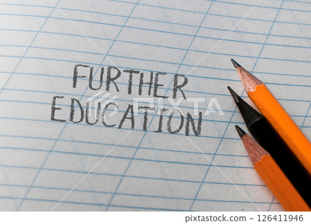 The pencils are placed in a way that they appear to be leaning on the paper The pencils are placed in a way that they appear to be leaning on the paper 126411946