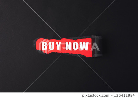 Buy now is written on a torn piece of paper 126411984