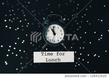 Black and white photo of a clock with the time of 11:30 126412020