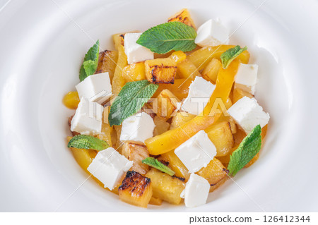 Colorful Salad With Feta, Grilled Peppers, Pineapple And Fresh Mint Leaves Colorful Salad With Feta, Grilled Peppers, Pineapple And Fresh Mint Leaves 126412344