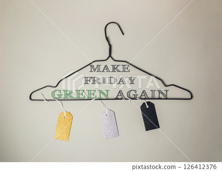 Clothes hanger with tags on it that say Make Friday Green Again Clothes hanger with tags on it that say Make Friday Green Again 126412376
