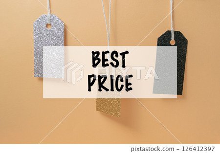 Three tags hanging from a string, each with a different price tag Three tags hanging from a string, each with a different price tag 126412397