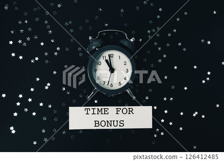 Black and white photo of a clock with the words Time for Bonus written below 126412485