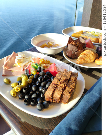 Dining Room Buffet aboard the abstract luxury cruise ship. Healthy breakfast at modern liner concept 126412554