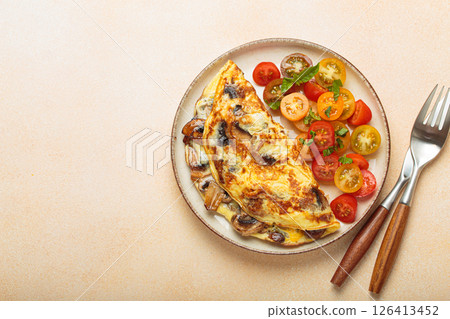 Delicious meal with omelette with mushrooms and cherry tomatoes served on plate, healthy breakfast top view, space for text 126413452