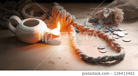 Coins on the table with rope for the gallows 126413481