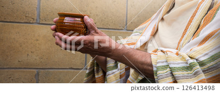 Old cup in the hands Old cup in the hands 126413498
