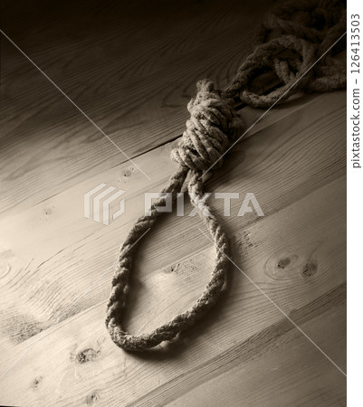 A loop made from old thick rope A loop made from old thick rope 126413503