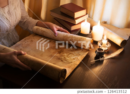 Hands with an old scroll Hands with an old scroll 126413512