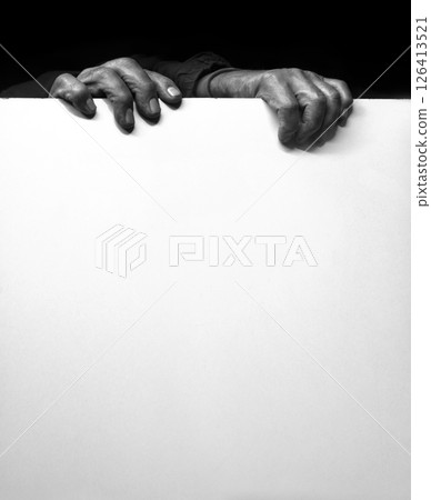 Old man hides after the wall 126413521