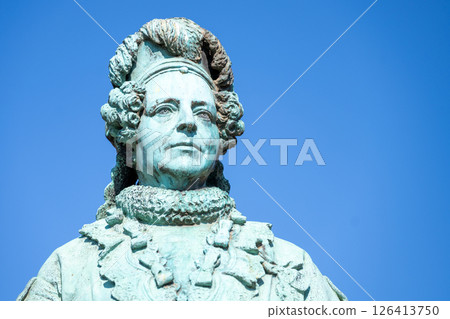 This beautiful statue of Queen Caroline Amalie stands proudly in the Rosenborg Castle Garden in Copenhagen, Denmark. It reflects the artistry and history of this enchanting location. 126413750