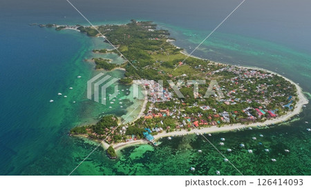 Aerial drone footage revealing the stunning beauty of Malapascua Island in the Philippines, featuring vibrant coral reefs, turquoise waters, and white sandy beaches Aerial drone footage revealing the stunning beauty of Malapascua Island in the Philippines, featuring vibrant coral reefs, turquoise waters, and white sandy beaches 126414093