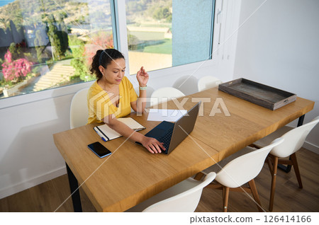 Remote Work in a Minimalist Home Office Setting with Natural Light Remote Work in a Minimalist Home Office Setting with Natural Light 126414166