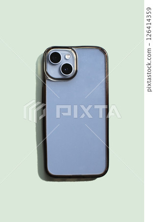 Phone with transparent phone case mock up displays dirty surface, emphasizing contrast between new and used condition 126414359