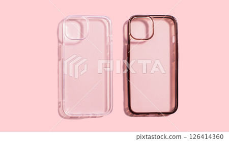 Transparent phone case comparison showing clean and dirty sides on pink background, illustrating the impact of daily use of mobile accessories. Transparent phone case comparison showing clean and dirty sides on pink background, illustrating the impact of daily use of mobile accessories. 126414360