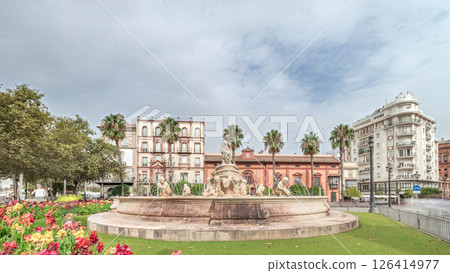Hispalis Fountain in Seville surrounded by flowers and historical buildings timelapse 126414977