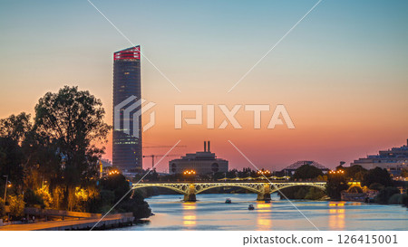 Seville skyline day to night timelapse with Torre Sevilla and Triana Bridge 126415001