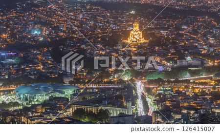 Illuminated Tsminda Sameba Cathedral or Holy Trinity Cathedral of Tbilisi and Public Service Hall aerial day to night timelapse Georgia Illuminated Tsminda Sameba Cathedral or Holy Trinity Cathedral of Tbilisi and Public Service Hall aerial day to night timelapse Georgia 126415007