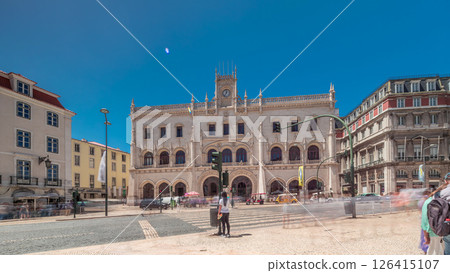 Rossio station in Lisbon timelapse hyperlapse. Front view with zebra crossing and street traffic. 126415107