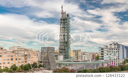 Timelapse hyperlapse of old steel refinery tower with spiral ramp in Lisbon's Park of Nations modern district. Portugal 126415122